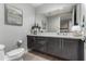Modern bathroom with a toilet, vanity, and plenty of natural light at 16580 N 92Nd St # 2003, Scottsdale, AZ 85260