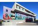 Low angle of a multi-story building with a painted mural at 16580 N 92Nd St # 2003, Scottsdale, AZ 85260