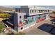 Modern building with a unique painted mural design and visible parking at 16580 N 92Nd St # 2003, Scottsdale, AZ 85260