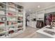 Spacious walk-in closet featuring custom shelving, drawers, and ample storage space at 16580 N 92Nd St # 2003, Scottsdale, AZ 85260
