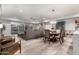 Open-concept living area with light wood floors, modern furnishings, and sliding glass doors to a private balcony at 16580 N 92Nd St # 2003, Scottsdale, AZ 85260