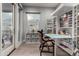 Bright home office featuring built-in shelving, storage and a work table at 16580 N 92Nd St # 2003, Scottsdale, AZ 85260