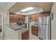 Spacious kitchen featuring a stainless steel refrigerator and a convenient laundry area at 17017 N 12Th St # 1106, Phoenix, AZ 85022