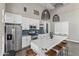 Kitchen featuring a kitchen island with seating, stainless steel appliances, and modern pendant lighting at 17017 N 12Th St # 1106, Phoenix, AZ 85022