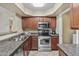 Well-lit kitchen features stainless steel appliances and ample cabinet space for storage at 17017 N 12Th St # 1106, Phoenix, AZ 85022