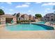 Community pool featuring waterfall feature, ample deck, and poolside lounge area at 17017 N 12Th St # 1106, Phoenix, AZ 85022
