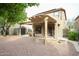 Cozy covered patio and fire pit area, surrounded by desert landscaping at 17062 N 184Th Dr, Surprise, AZ 85374
