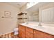 Bright bathroom featuring a double vanity, framed mirror, tiled floors, and a bathtub at 17062 N 184Th Dr, Surprise, AZ 85374