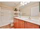 Bright bathroom featuring a double vanity, framed mirror, tiled floors, a bathtub and shower at 17062 N 184Th Dr, Surprise, AZ 85374