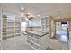Open bonus room includes built-in bookshelves and island workstation at 17062 N 184Th Dr, Surprise, AZ 85374