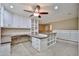 Spacious bonus room features custom desk, cabinets, and shelving at 17062 N 184Th Dr, Surprise, AZ 85374