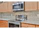 Updated kitchen with stainless steel microwave and stove, plus granite countertops at 17062 N 184Th Dr, Surprise, AZ 85374