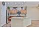 Spacious kitchen with stainless steel appliances, granite counters, and wood-look tile at 17062 N 184Th Dr, Surprise, AZ 85374