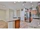 Large kitchen with island, stainless steel appliances, and wood-look tile flooring at 17062 N 184Th Dr, Surprise, AZ 85374
