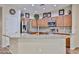 Bright kitchen features stainless appliances, granite counters, and light wood cabinetry at 17062 N 184Th Dr, Surprise, AZ 85374