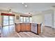Kitchen island features a stainless steel dishwasher and granite countertop at 17062 N 184Th Dr, Surprise, AZ 85374