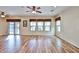 Spacious living room with wood-look tile flooring and natural light, perfect for entertaining and relaxation at 17062 N 184Th Dr, Surprise, AZ 85374