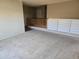 Upper loft featuring carpet, wood railing, and white shelving, perfect for a flexible living or recreation area at 17062 N 184Th Dr, Surprise, AZ 85374