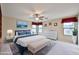 Serene main bedroom featuring a plush bed, natural light, and ample space for relaxation and rest at 17062 N 184Th Dr, Surprise, AZ 85374