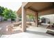 Covered patio boasts a built-in fire pit and views of the backyard at 17062 N 184Th Dr, Surprise, AZ 85374