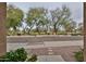 A picturesque street view with mature trees, offering a serene neighborhood setting at 17062 N 184Th Dr, Surprise, AZ 85374