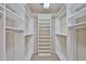Well-organized walk-in closet featuring adjustable shelving and racks for efficient storage at 17062 N 184Th Dr, Surprise, AZ 85374