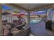 Cozy outdoor living space with comfortable seating, a fire pit, and a view of the refreshing pool at 17916 N 183Rd Ave, Surprise, AZ 85374