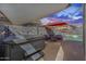 Relaxing backyard with a private hot tub, covered seating area, and charming string lights at 17916 N 183Rd Ave, Surprise, AZ 85374
