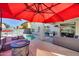 Backyard featuring a cozy seating area with a fire pit and a built-in gas grill near the refreshing pool at 17916 N 183Rd Ave, Surprise, AZ 85374
