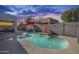 Stunning backyard featuring a sparkling pool, hot tub, and inviting lounge areas for entertaining at 17916 N 183Rd Ave, Surprise, AZ 85374