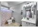 Bathroom featuring a vanity, shower with curtain, toilet and wall art with inspirational words at 17916 N 183Rd Ave, Surprise, AZ 85374