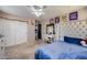 Bedroom showcasing closet doors, ceiling fan, and space for a desk at 17916 N 183Rd Ave, Surprise, AZ 85374