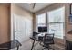 Bedroom with closet, carpeted floors, and desk at 17916 N 183Rd Ave, Surprise, AZ 85374