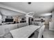 Open-concept living and dining area with modern lighting and stylish decor at 17916 N 183Rd Ave, Surprise, AZ 85374