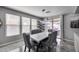Dining area with gray chairs, contemporary light fixture, and sliding doors to the patio at 17916 N 183Rd Ave, Surprise, AZ 85374
