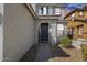 Charming front entrance with a welcoming door, complemented by tasteful landscaping and a cozy entryway at 17916 N 183Rd Ave, Surprise, AZ 85374