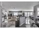 Open floorplan featuring a kitchen with white cabinetry, stainless steel appliances, and sleek countertops at 17916 N 183Rd Ave, Surprise, AZ 85374