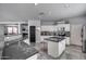 Spacious kitchen with white cabinets, stainless steel appliances, granite countertops, and access to the living room at 17916 N 183Rd Ave, Surprise, AZ 85374