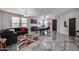 Spacious living room featuring sleek tile floors, a pool table, and comfortable seating at 17916 N 183Rd Ave, Surprise, AZ 85374