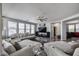 Open living room featuring modern furnishings and a stylish ceiling fan, perfect for relaxation and entertaining at 17916 N 183Rd Ave, Surprise, AZ 85374