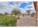 Beautiful view of the landscaped yard, with green shrubbery and desert trees at 188 N Nueva Ln, Casa Grande, AZ 85194