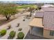 Aerial view of the covered patio, landscaping, and golf course in the background at 188 N Nueva Ln, Casa Grande, AZ 85194