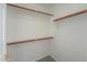 A well-organized walk-in closet with rods and shelves to maximize storage at 188 N Nueva Ln, Casa Grande, AZ 85194