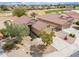 Aerial view of home's front exterior, landscaping, and a well-manicured yard at 188 N Nueva Ln, Casa Grande, AZ 85194
