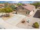Aerial front exterior featuring a well-manicured yard and a charming home at 188 N Nueva Ln, Casa Grande, AZ 85194