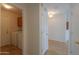 The hallway features tile flooring and leads to a laundry room at 188 N Nueva Ln, Casa Grande, AZ 85194