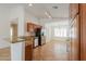 Open kitchen with wood cabinets, granite countertops, and stainless appliances, perfect for entertaining at 188 N Nueva Ln, Casa Grande, AZ 85194