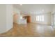 Inviting living space with tile floors, breakfast bar, and sliding door access at 188 N Nueva Ln, Casa Grande, AZ 85194