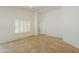 Open-plan living room with tile floors and large windows for natural light at 188 N Nueva Ln, Casa Grande, AZ 85194