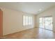 Sun-filled living room with tile floors, plantation shutters, and patio access at 188 N Nueva Ln, Casa Grande, AZ 85194